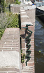 Ornament (paalworm?) aan de Amstelzijde
<br/>
Marcel Westhoff, juli 2015